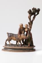 Meisterhaft gefertigte und in zurückhaltenden Farbtönen gehaltene Figuren eines jungen Schäferpaares mit Ziege unterm Baum